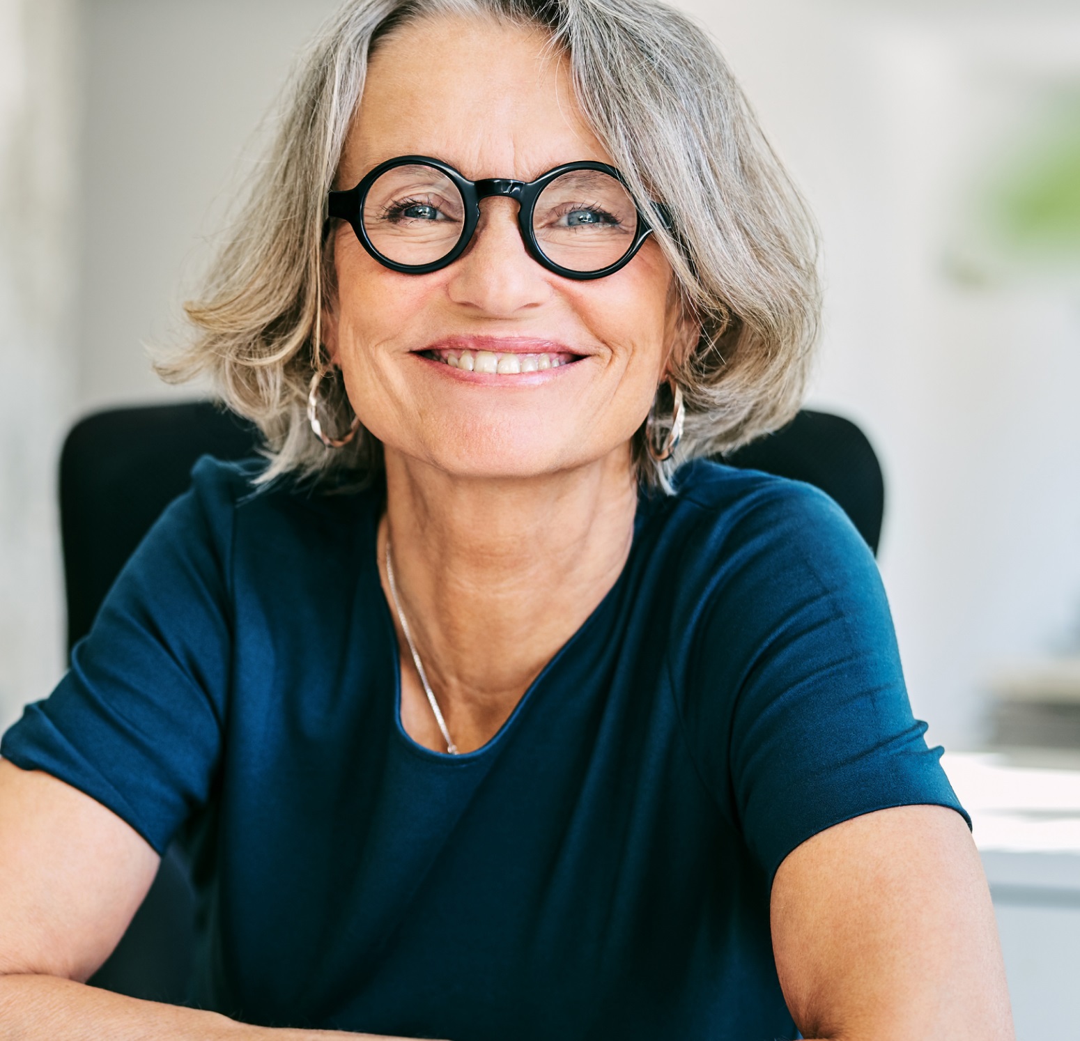 Portrait Of Smiling Senior Woman With Eyeglasses